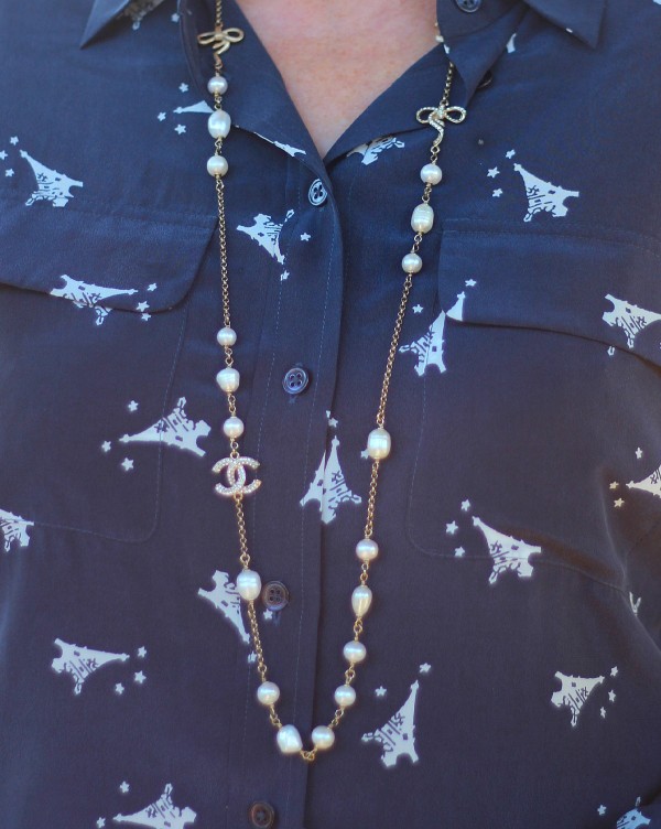 silk shirt, pearl station necklace, Eiffel Tower print