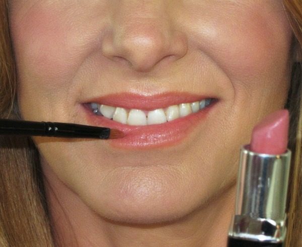 apply lipstick with brush for precision