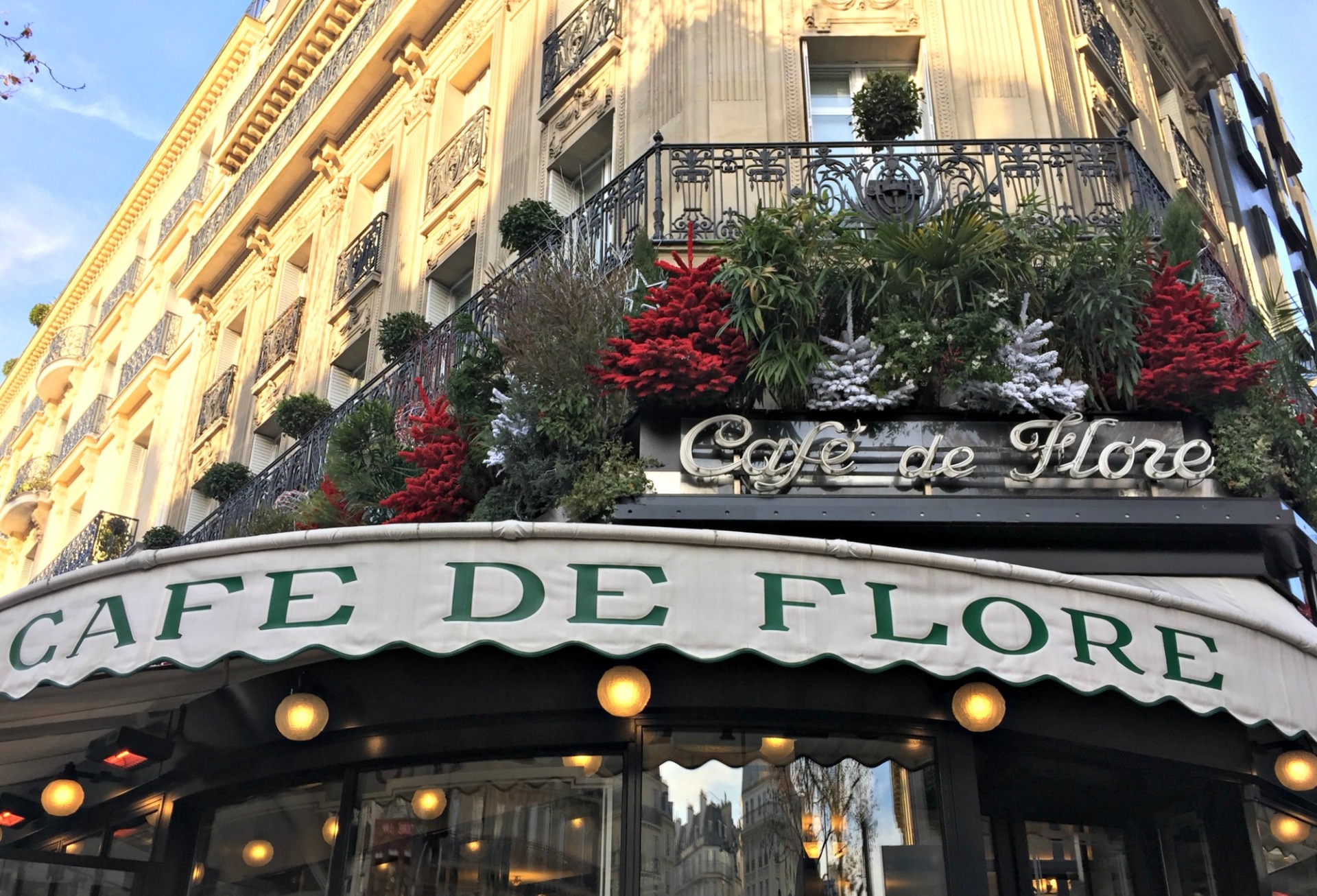 Paris St. Germain Cafe de Flore decorated for Christmas. Details at une femme d'un certain age.