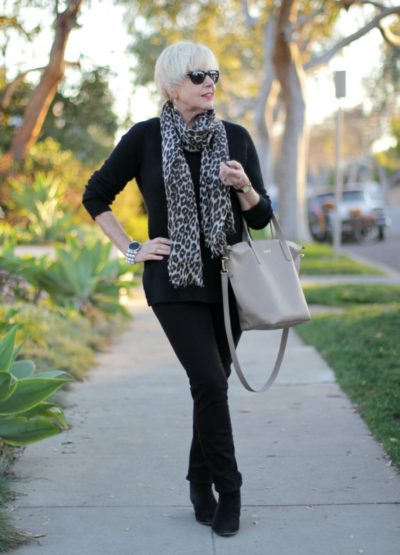 An All-Black Outfit Gets A Lift From Accessories In Lighter Neutrals