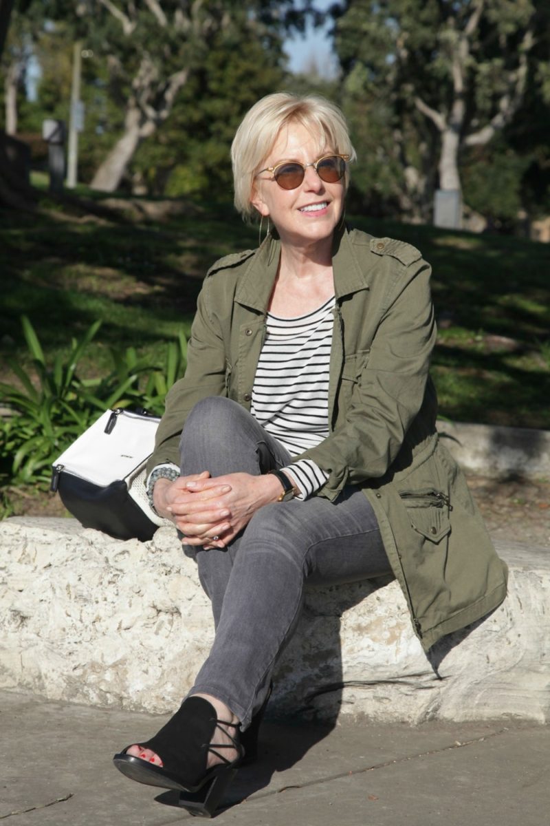 outfit with grey denim, utility jacket, striped tee