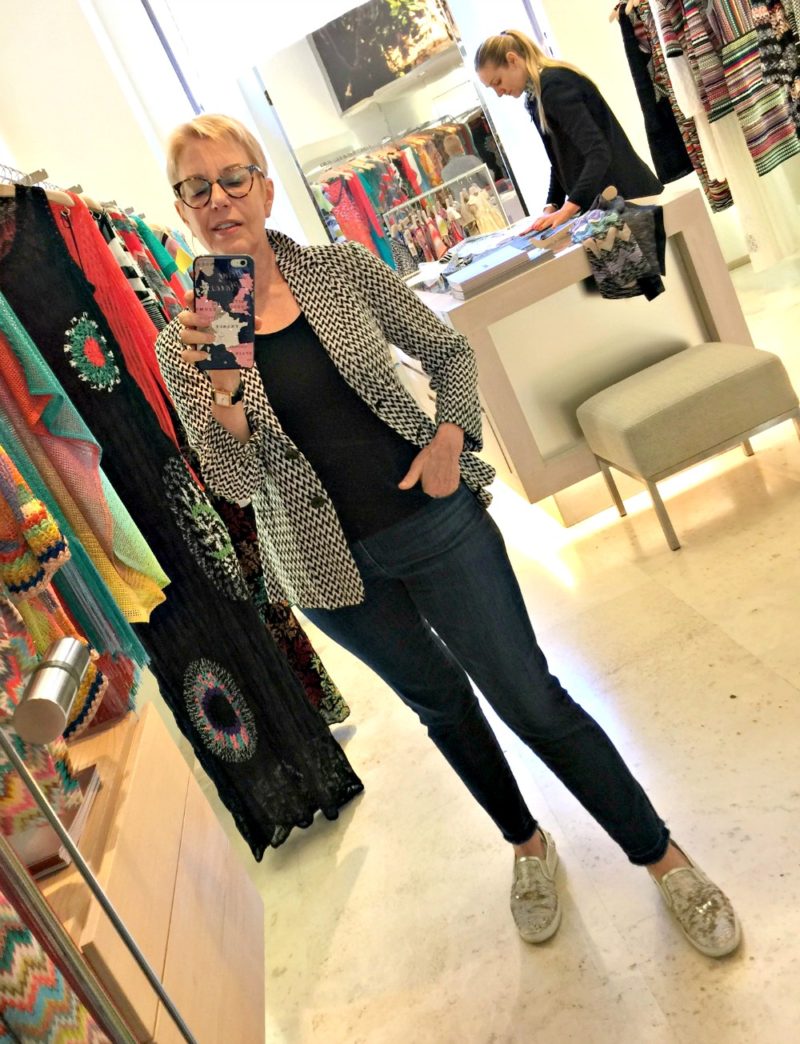 trying on a Missoni jacket