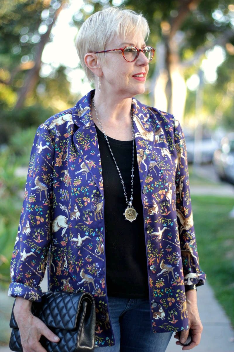 details: Susan B. of une femme d'un certain age wears a J.Crew silk pajama top as a jacket, with a Chanel bag and French Kande jewelry