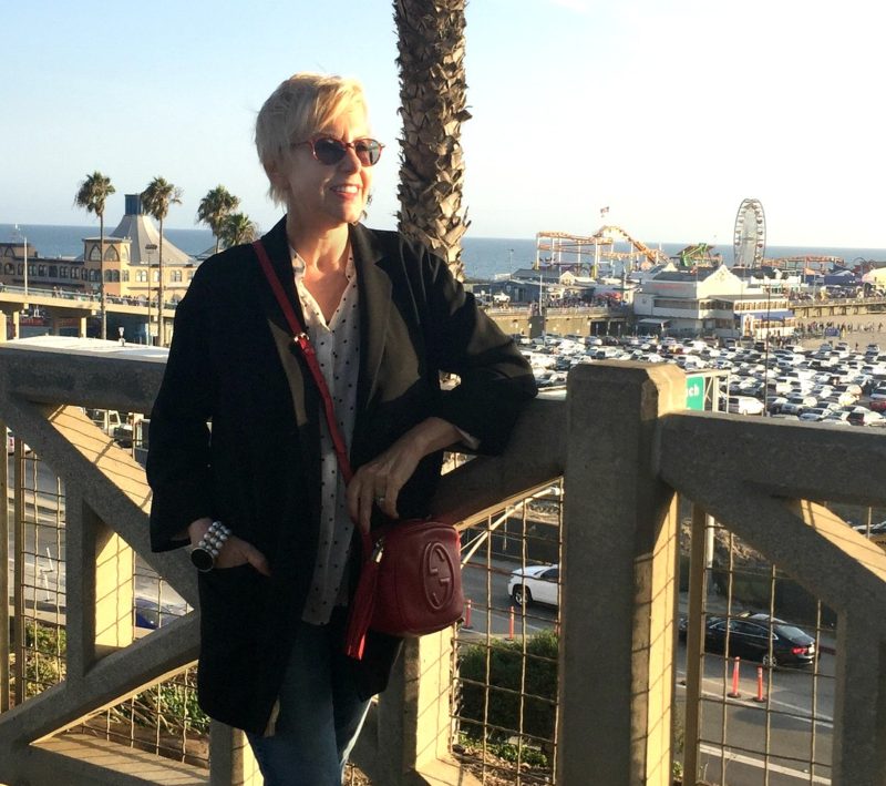 casual outfit with black jacket and red Gucci bag. Details at une femme d'un certain age.