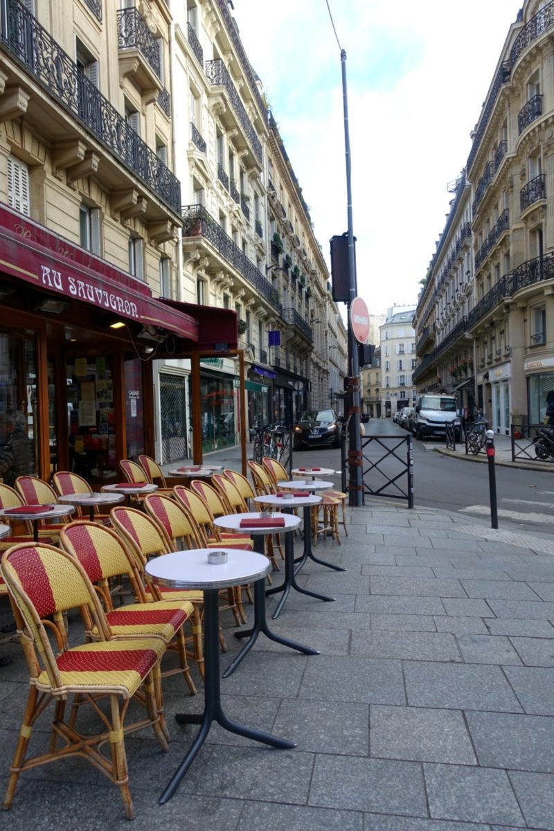 Paris cafe on a Sunday morning. Details at une femme d'un certain age.