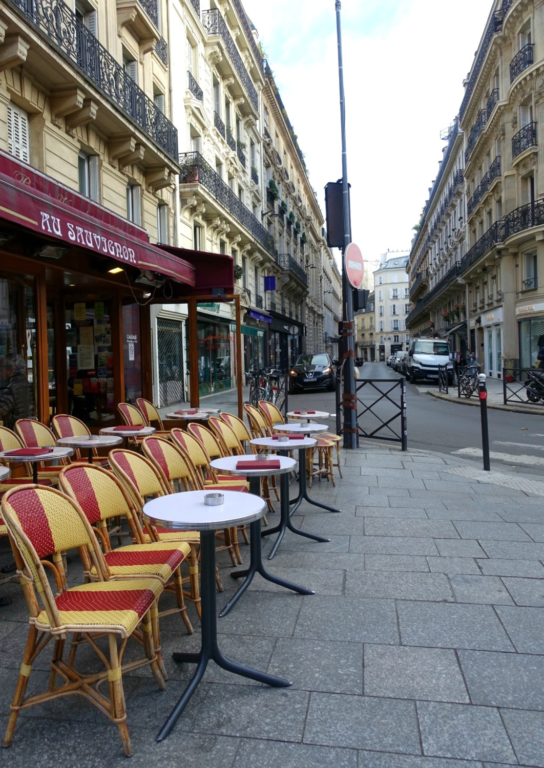 Paris sidewalk cafe ready for business. Details at une femme d'un certain age.