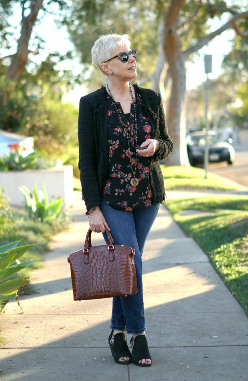 Casual outfit with IRO fringe jacket, floral top, jeans and Brahmin bag. Details at une femme d'un certain age.