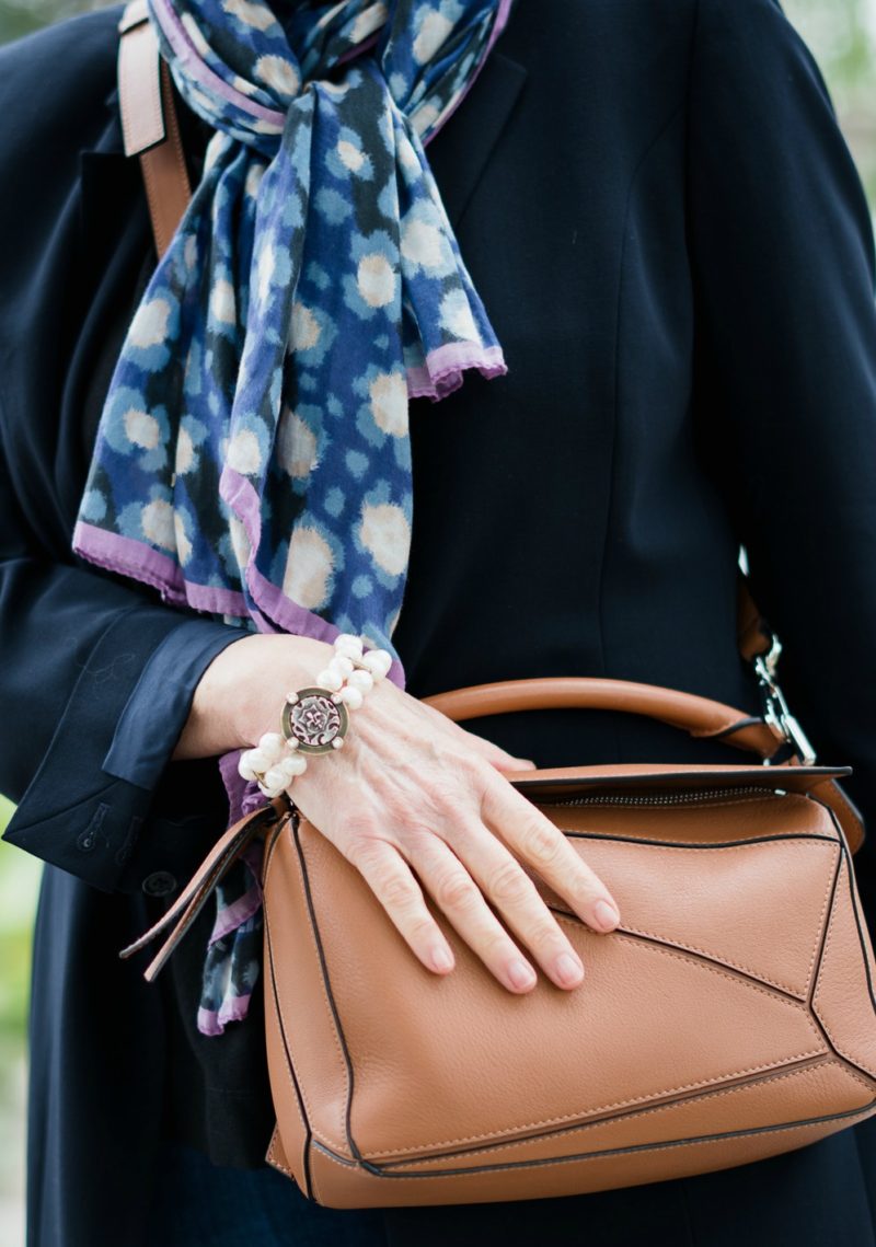 Kenzo cotton silk scarf, French Kande pearl bracelet, Loewe puzzle bag. Details at une femme d'un certain age.