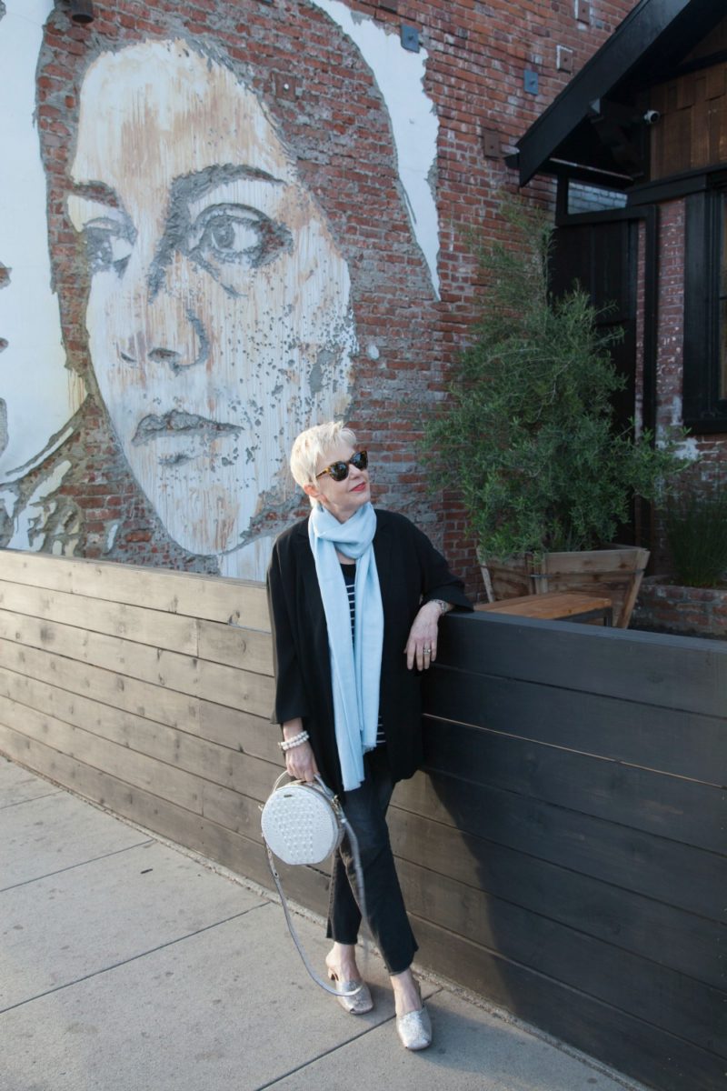 Out and about in Venice Beach. Wearing a long black jacket and pastel blue scarf. Details at une femme d'un certain age.