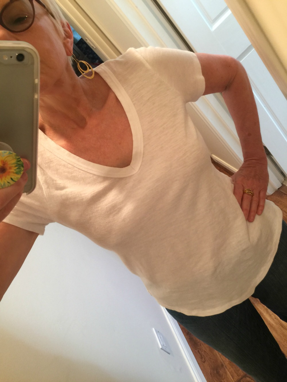 Style blogger Susan B. models an Eileen Fisher white v-neck tee. Details at une femme d'un certain age.