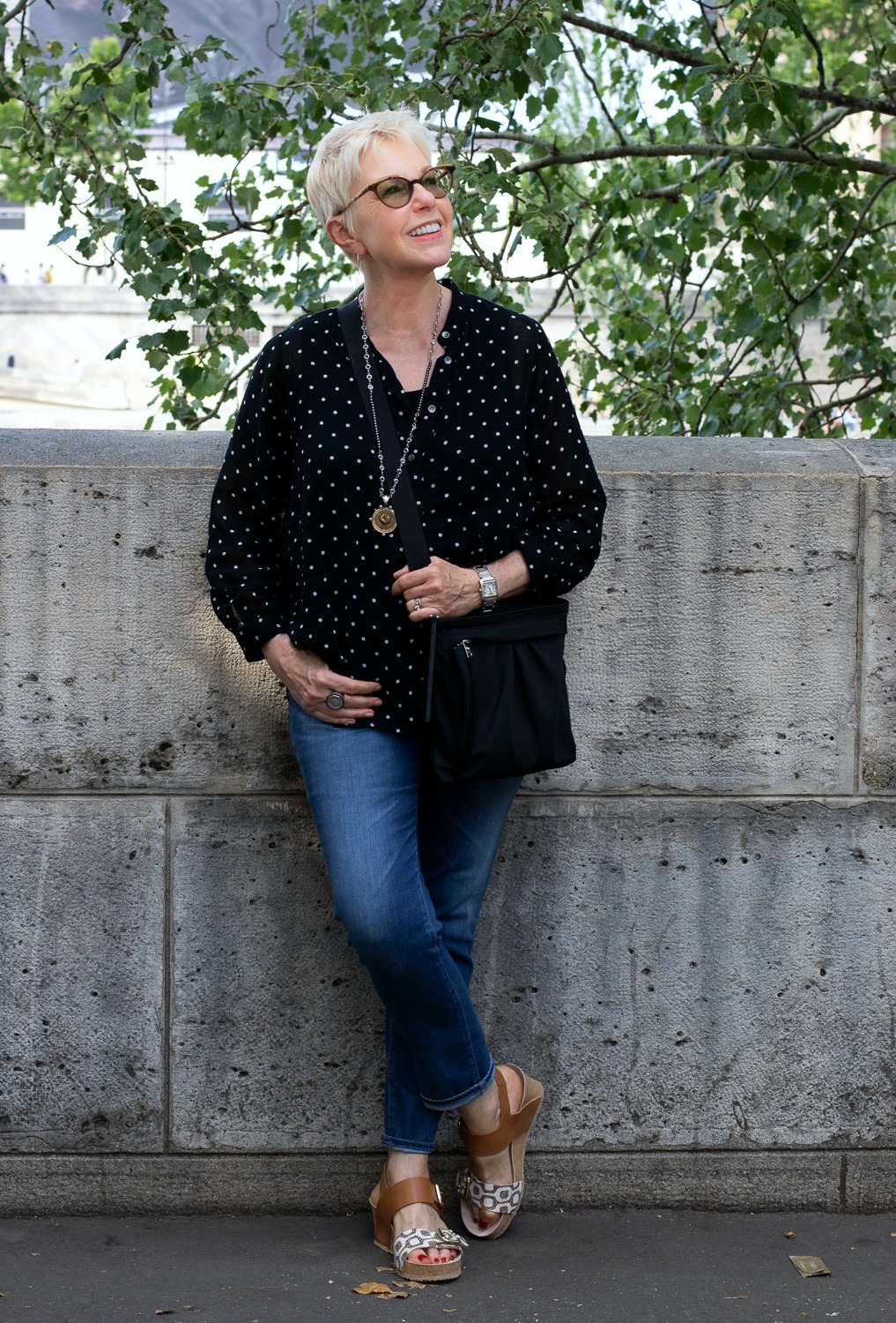 Style blogger Susan B. wears a polka dot top and jeans in Paris. Details at une femme d'un certain age.