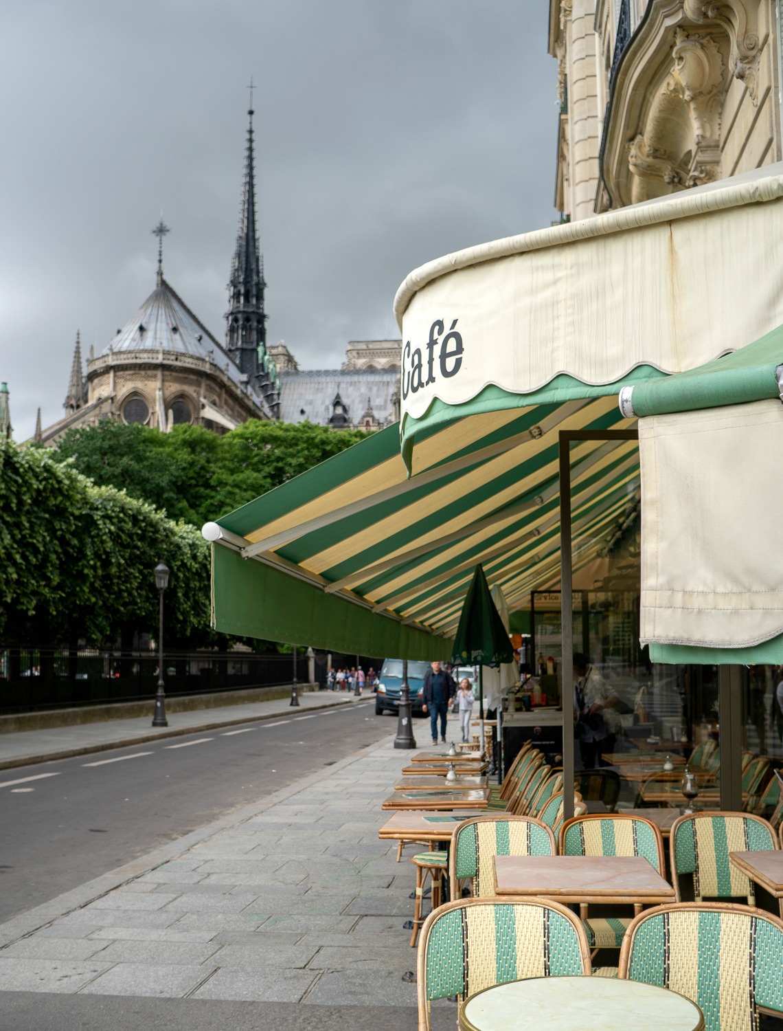 Sidewalk cafe near Notre Dame in Paris. Details at une femme d'un certain age.