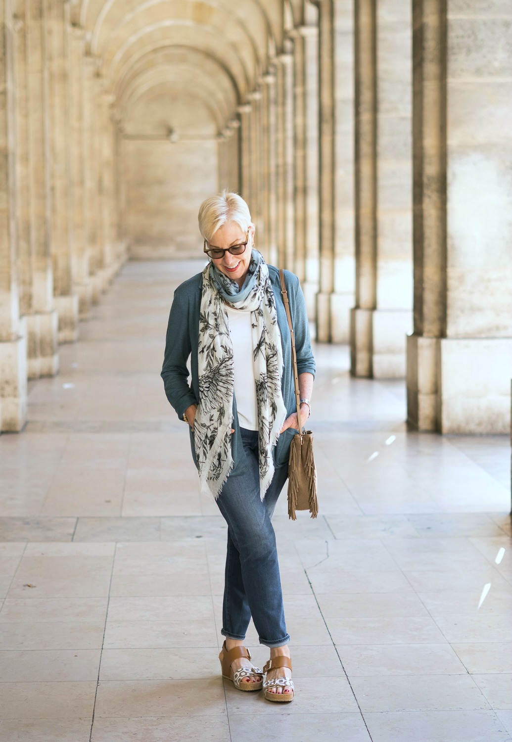 Wearing in Paris: a blue-green linen jacket, botanical print scarf, jeans and wedge sandals. Details at une femme d'un certain age.