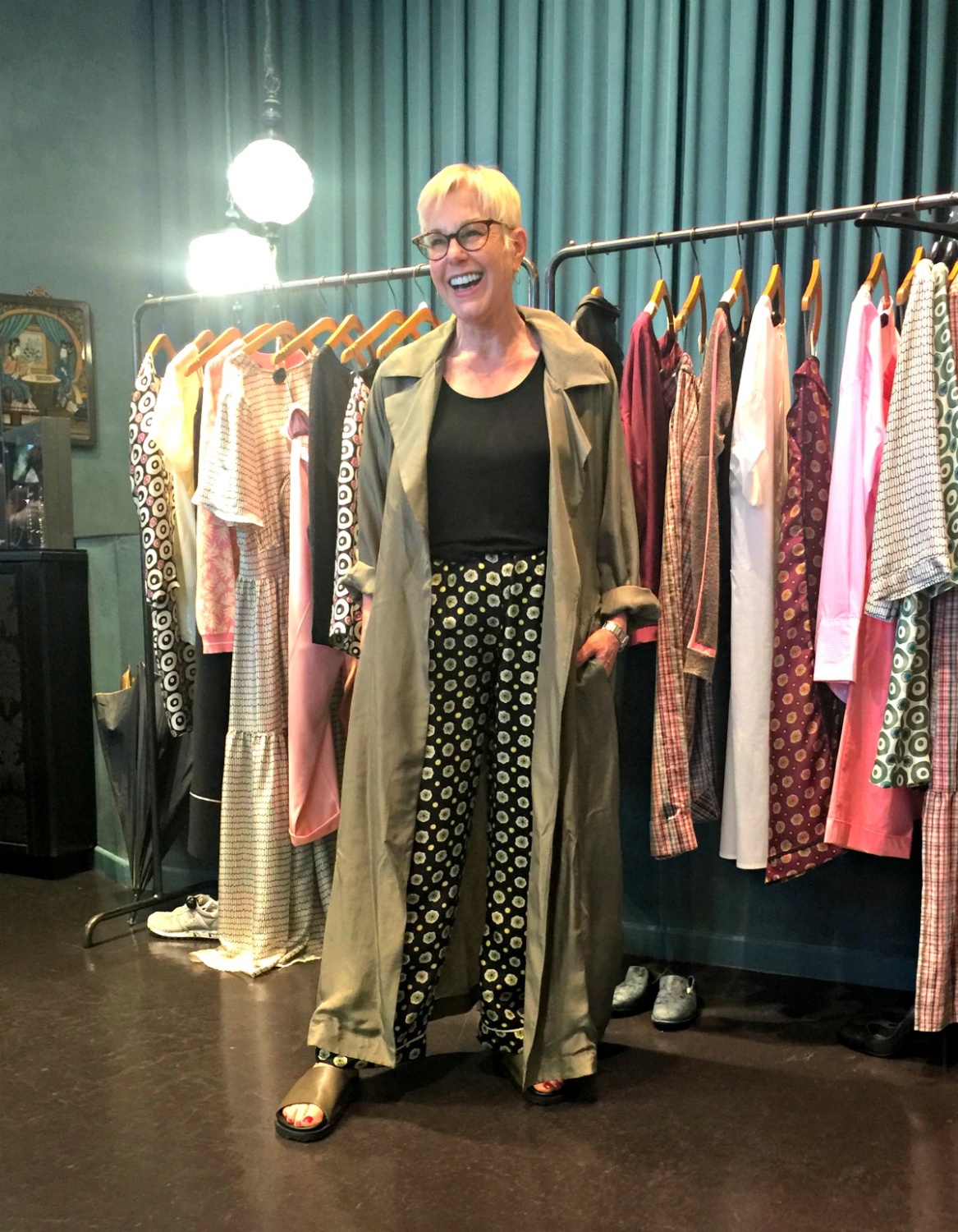 Trying on printed pants and a silky trench coat at Momoni in Paris. Details at une femme d'un certain age.