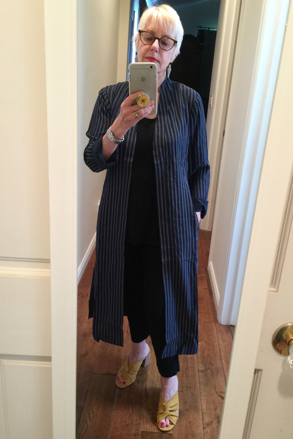 Style blogger Susan B. tries on a striped duster jacket from Nordstrom Anniversary Sale. Details at une femme d'un certain age.