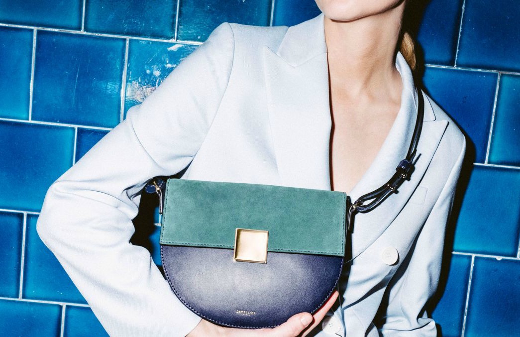 Navy and pine saddle bag from DeMellier London. Details at une femme d'un certain age.