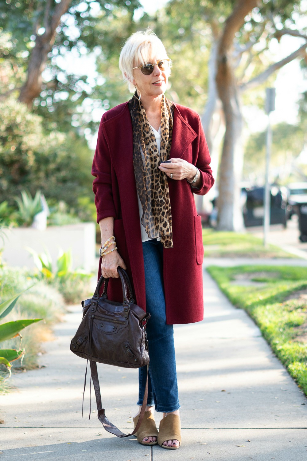 Style blogger Susan B. wears a J.Crew sweater-jacket, leopard print scarf and denim. Details at une femme d'un certain age.