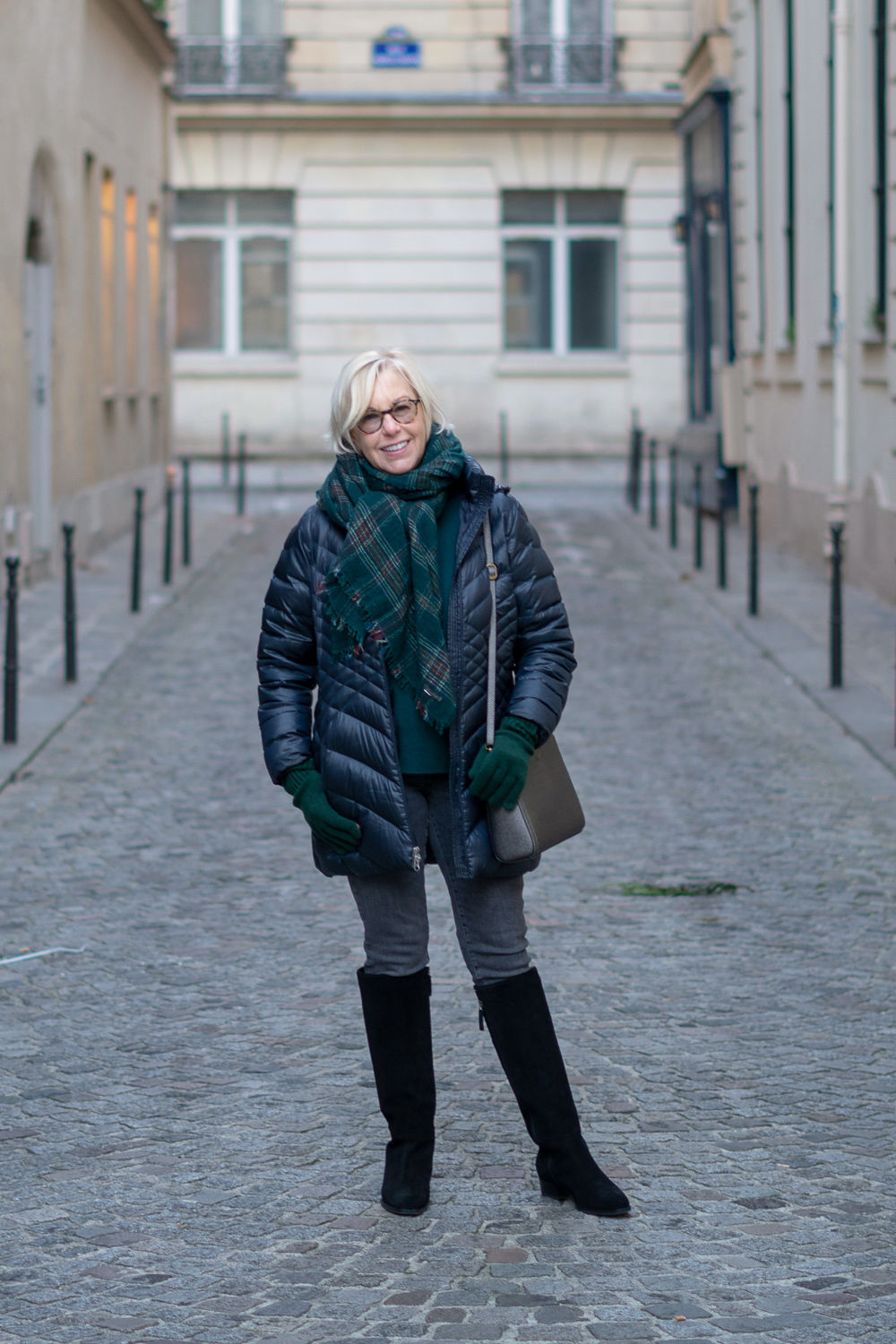 Winter travel outfit with green and navy. Details at une femme d'un certain age.