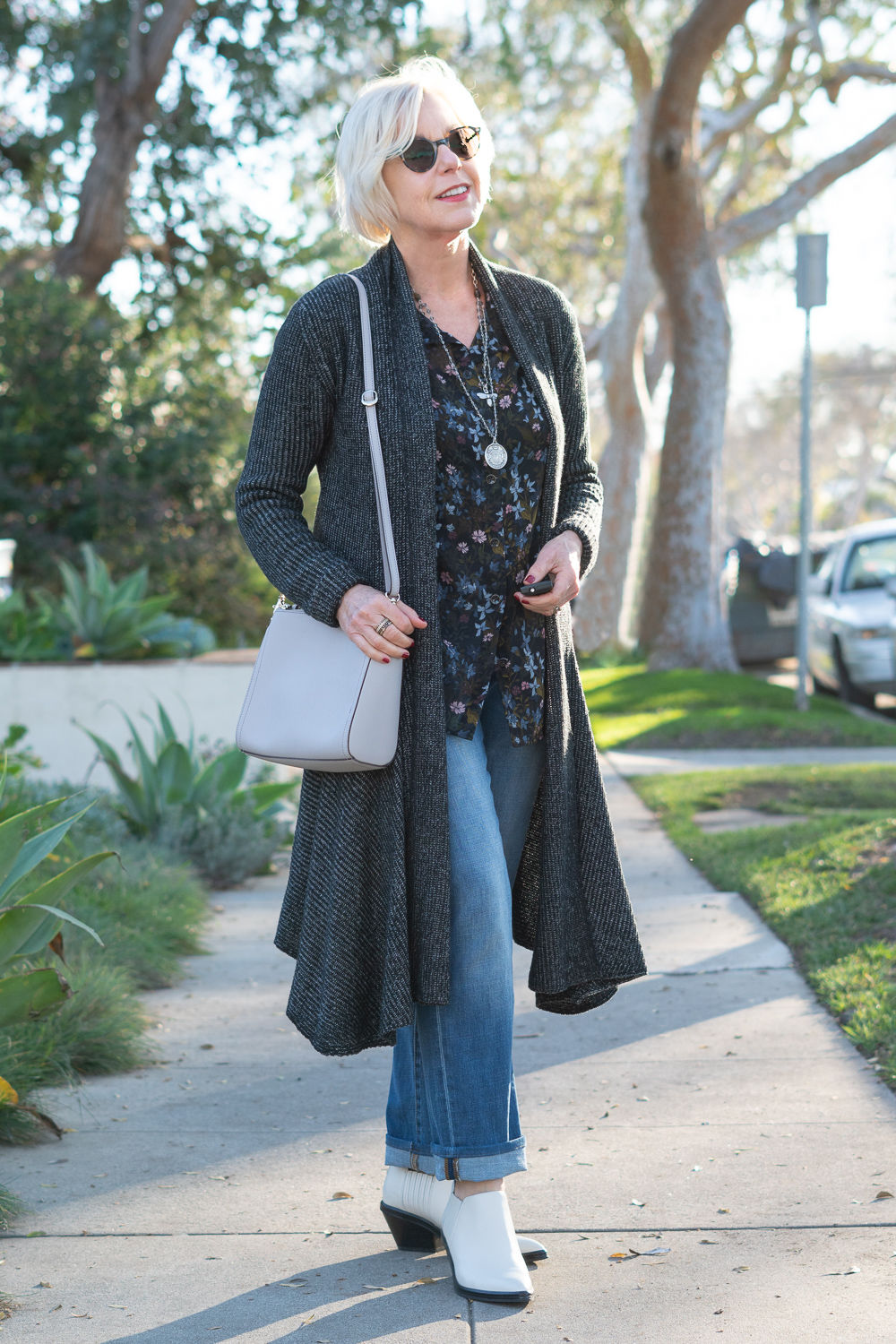 Style blogger Susan B. wears separates from the Cabi fall collection. Duster cardigan, floral blouse and straight leg jeans. More at une femme d'un certain age.
