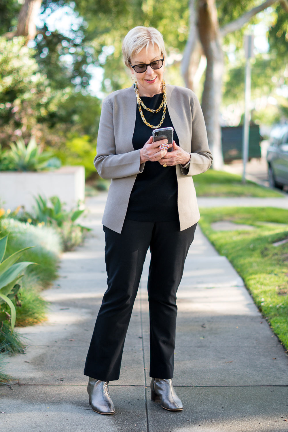 Susan Blakey of une femme d'un certain age wears M.M. LaFleur separates in black with a taupe jacket.