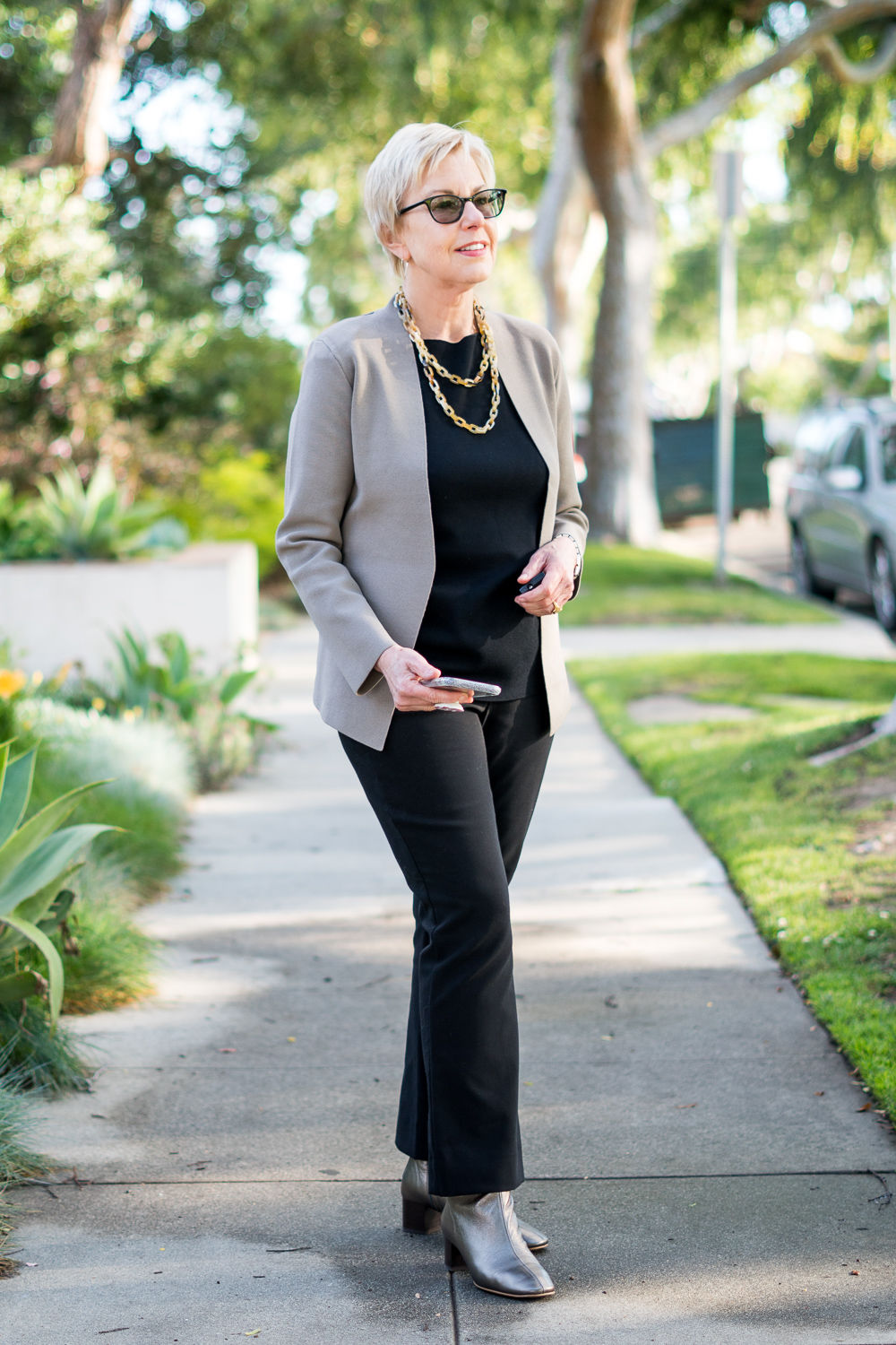 Susan Blakey of une femme d'un certain age wears M.M. LaFleur separates in black with a taupe jacket.