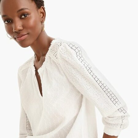 J.Crew eyelet top in white. Details and more Paris summer style trends at une femme d'un certain age.