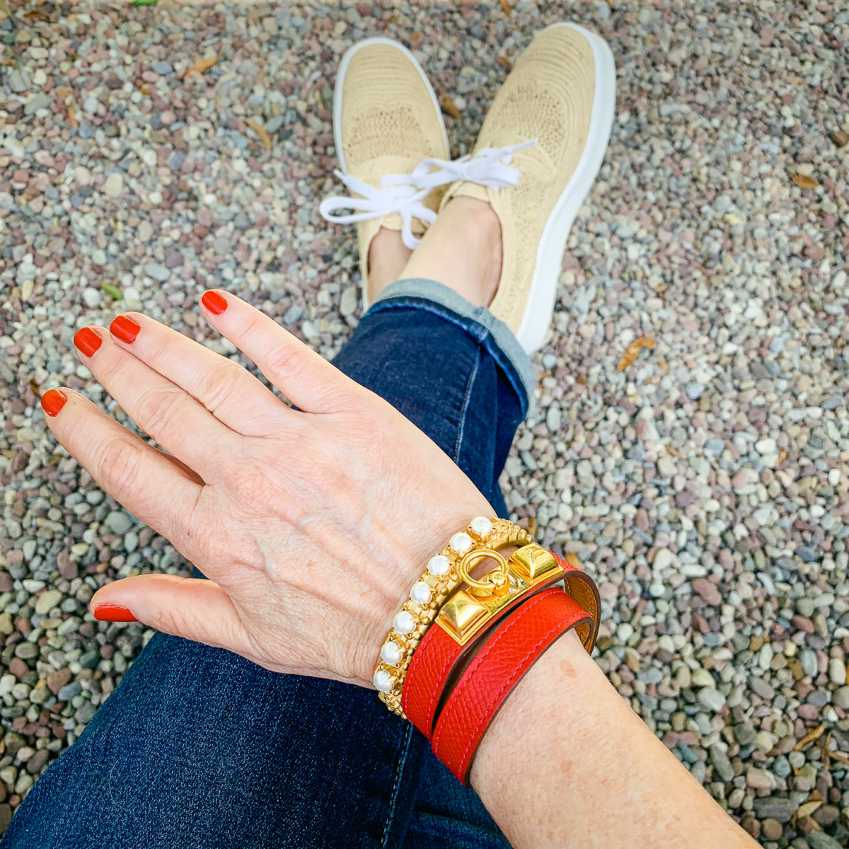 Susan B. of une femme d'un certain age wears French Kande gold pearl and Hermes leather wrap bracelets. Answers to your questions about my color and style analysis.