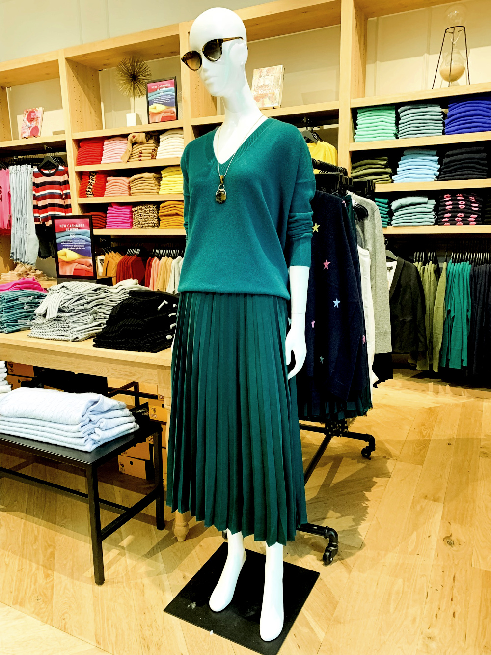Tonal dressing: Teal green sweater and forest green pleated skirt from J.Crew. Details at une femme d'un certain age.