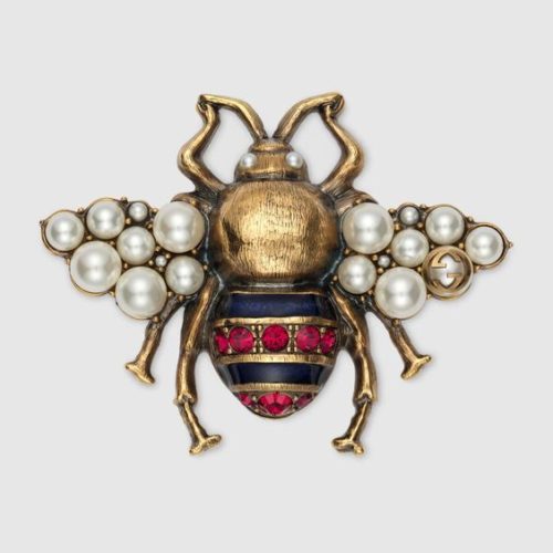 Gucci bee brooch in gold tone with pearl detail. More bee jewelry at une femme d'un certain age.