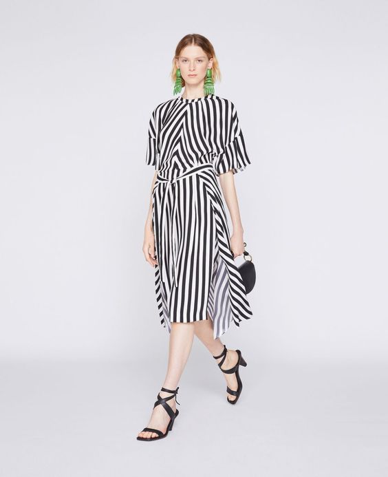 A silk striped dress from Stella McCartney, a sustainable fashion designer. Details at une femme d'un certain age.