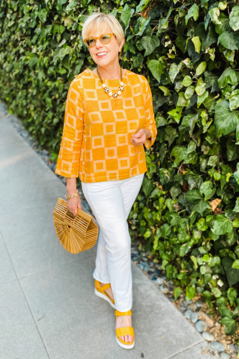 Susan B. wears an Ace & Jig lightweight summer top, white jeans and yellow Eileen Fisher sandals. Details at une femme d'un certain age.