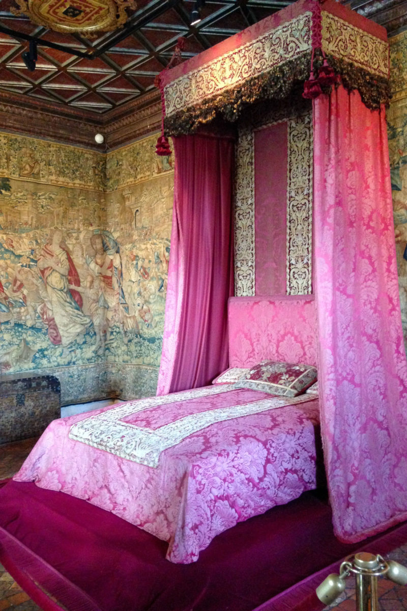 Bedroom with wall tapestries at Chateau de Chenonceau in the Loire region of France. Details at une femme d'un certain age.
