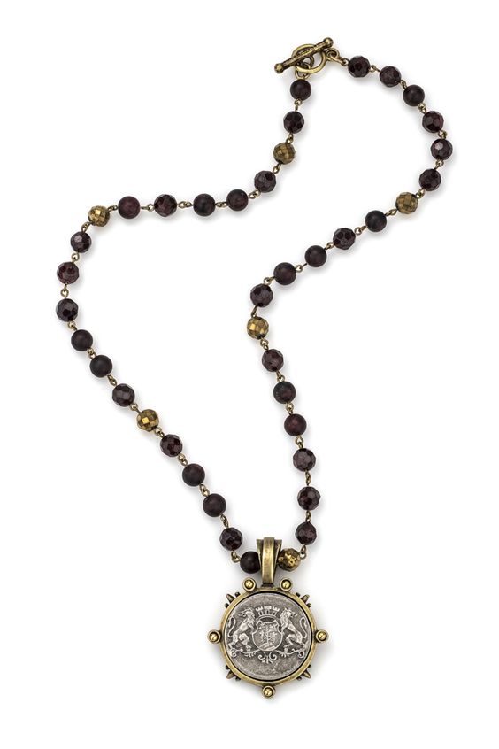 Paris-inspired jewelry from French Kande. Stone necklace in "garnet mix" with vintage French medallion. Details at une femme d'un certain age.