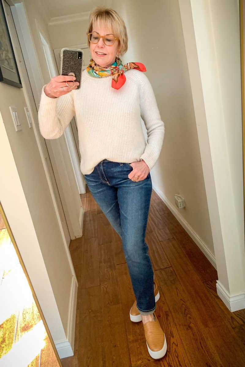 Casual outfit with a fisherman sweater, jeans, and silk scarf. Details at une femme d'un certain age.