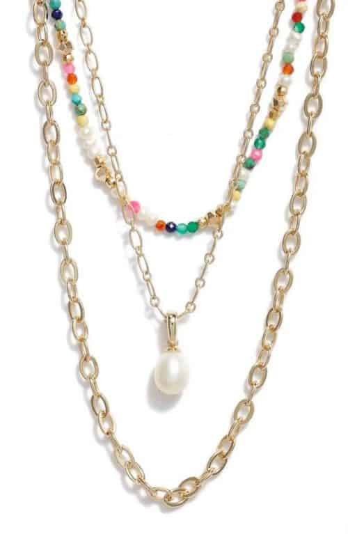 Kendra Scott layered necklace with colored beads and pearl pendant.