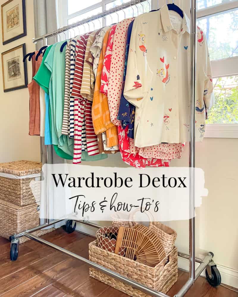 Wardrobe detox tips: women's tops on hanging rack by window.