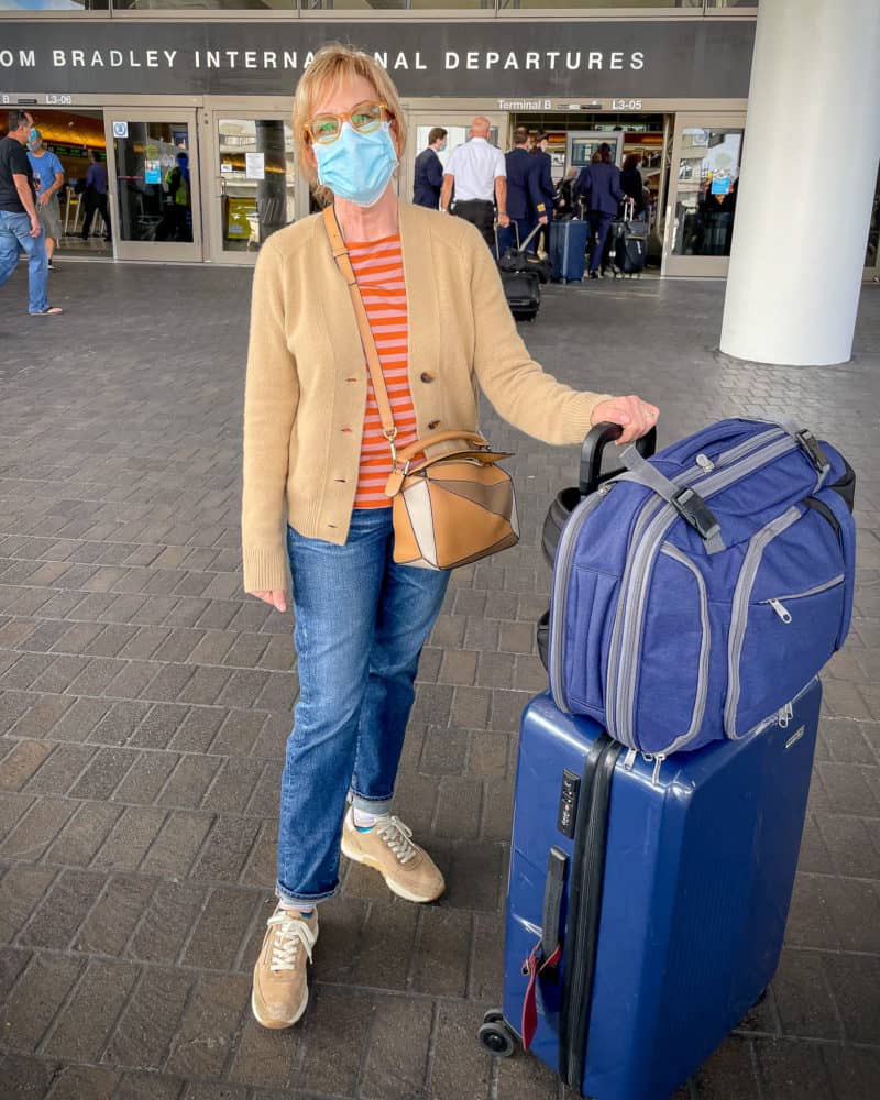 Susan B. at airport, packed and ready for long flight.