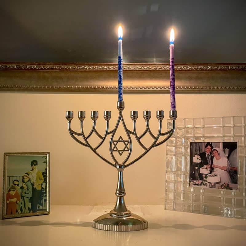 Hanukkah menorah with first night candle lit.