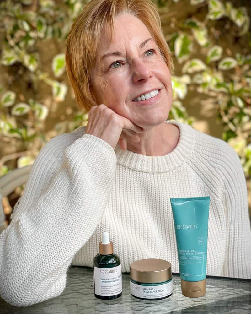 Susan B. with Biossance skincare products: NEW Squalane + Copper peptide Rapid Plumping Serum, Squalane Omega Repair Creme, Squalane + Zinc Mineral Sunscreen.