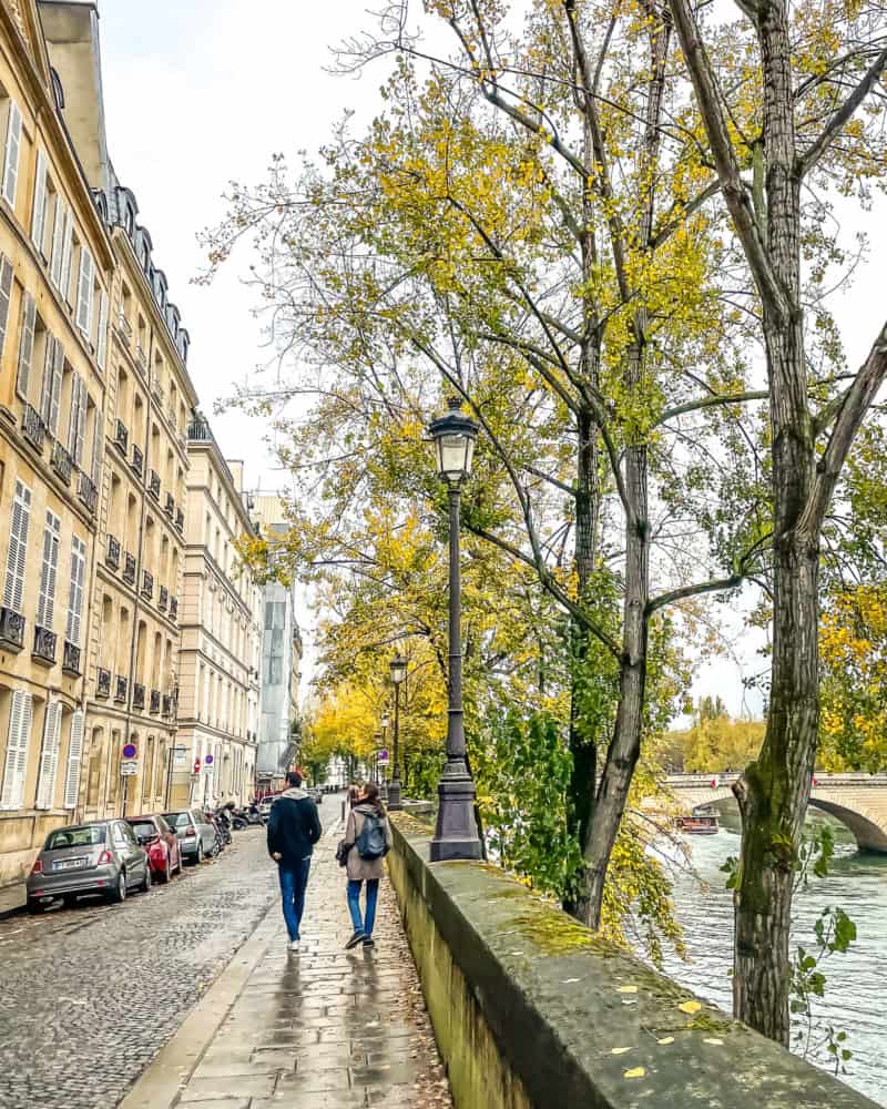 Strolling along the quai on a wet day in Paris.