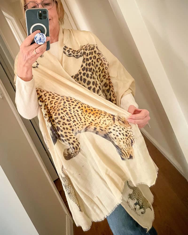Susan B. wears a leopard print cashmere-silk wrap from Black UK.