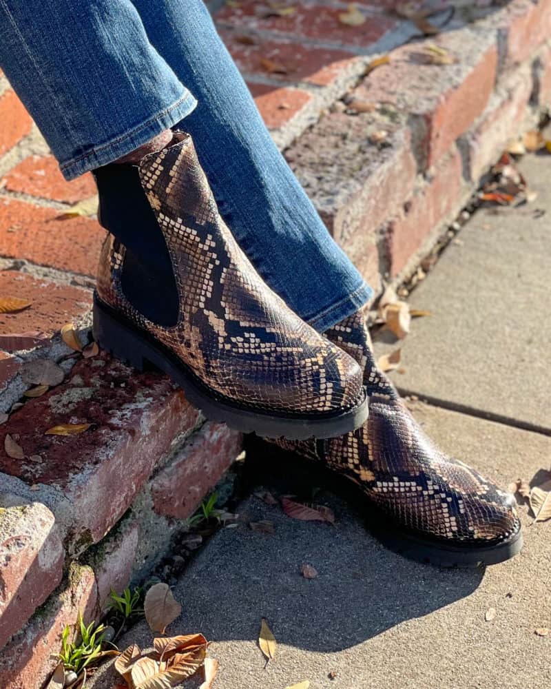 Detail: Susan B. wears Sole Bliss Roxy lug-sole boots in snakeprint.