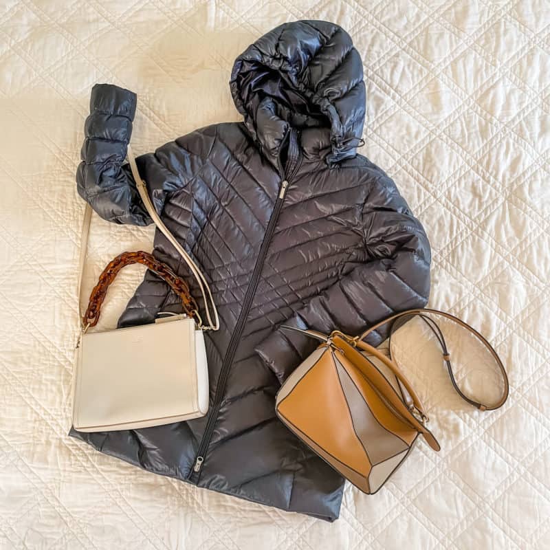 packable down coat and two handbags for travel.