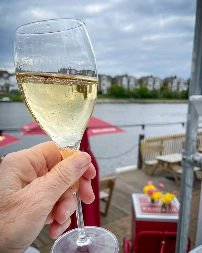Sipping Bollinger champagne along the Thames in Hampton Court.