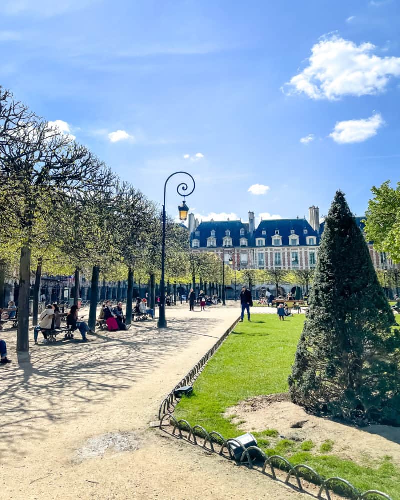 Springtime in Paris: a sunny Sunday in Place des Vosges, Paris.