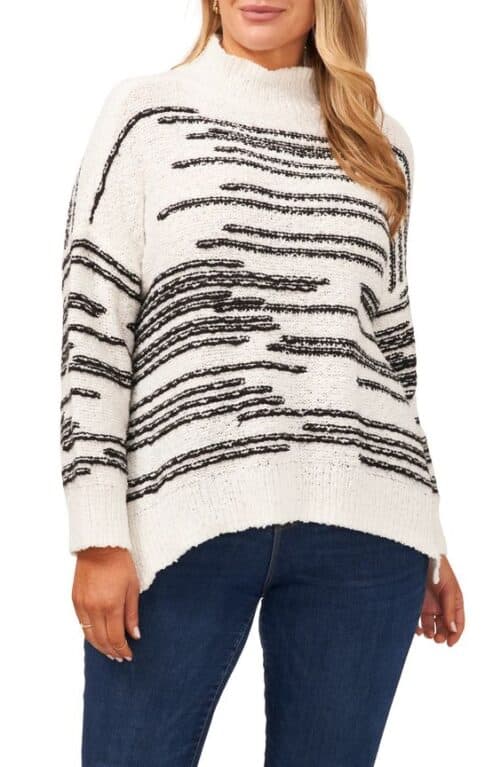 Vince Camuto striped mock neck sweater in black and white.