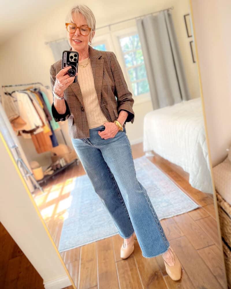 Susan B. wears a cropped plaid blazer, ribbed knit top, wide leg jeans, gold bangle & slingback shoes.