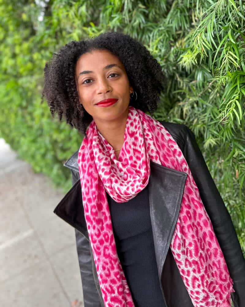 Ashley wears the magenta pink Winter leopard scarf from Black UK