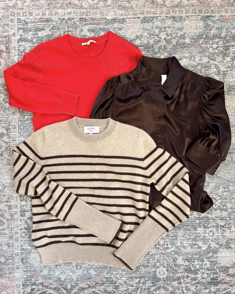 Susan B's travel capsule wardrobe for London: tops & pullovers. A red merino layering sweater, espresso silk blouse, striped cashmere crewneck sweater.