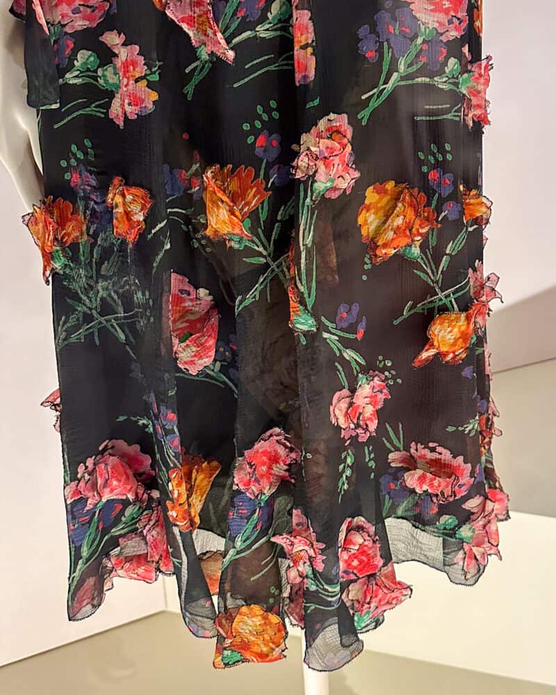 Dimensional details: 3-D petals on Chanel silk dress.